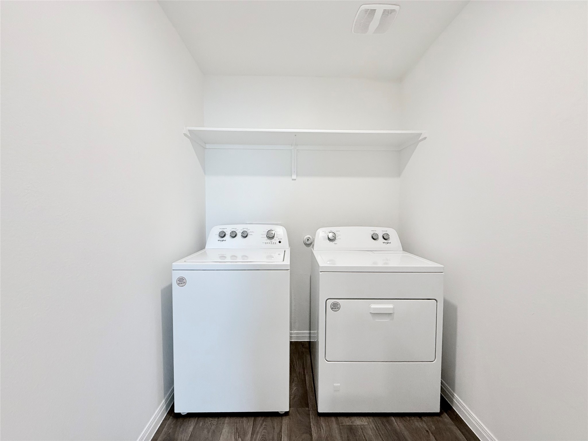 598 Gladiola Loop Kyle, TX 78640 - Photo 18 of 33 Laundry room featuring dark wood-type flooring and separate washer and dryer