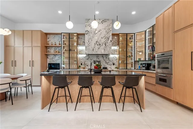 a kitchen with a table and chairs in it