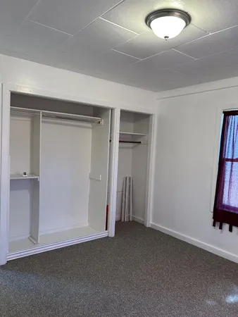a room with red walls and a window