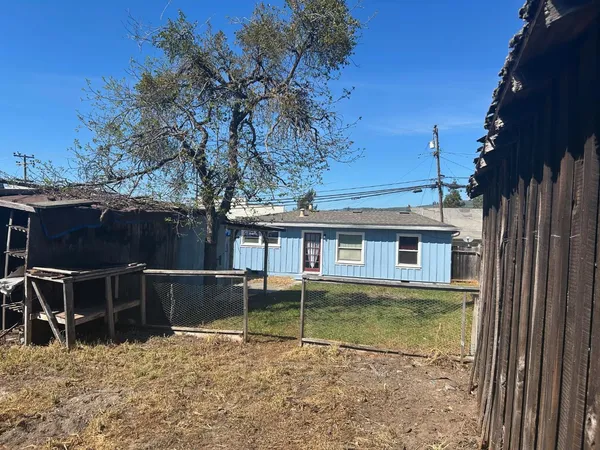 a view of a backyard with furniture