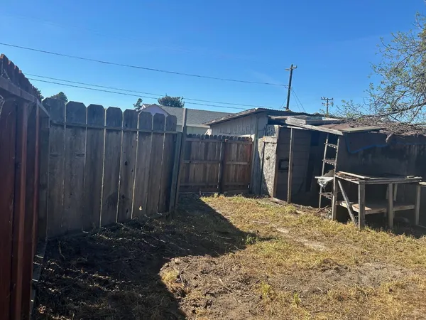 a view of a backyard of the house