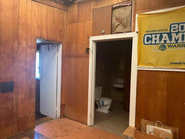 a view of a bathroom with a shower curtain