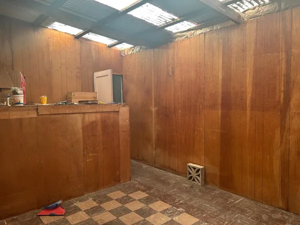a bathroom with a glass shower door