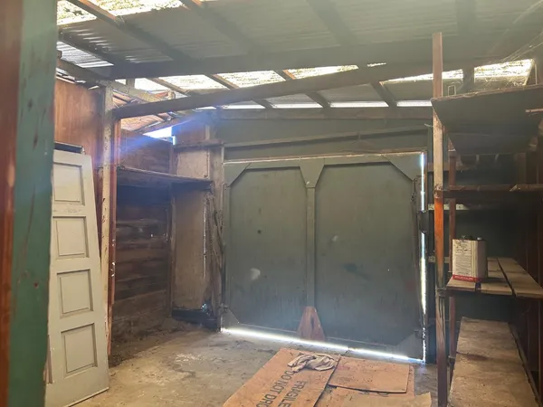 a view of a backyard of the house