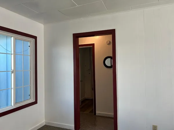 a view of a hallway with closet and closet