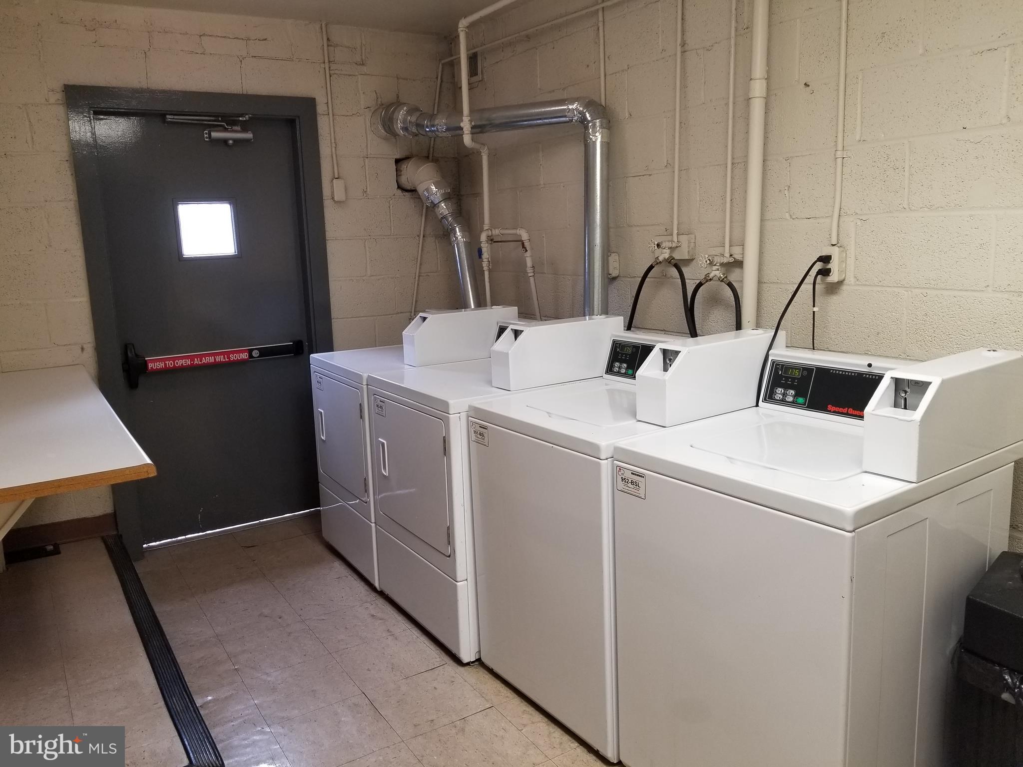 11400 Cherry Hill Road, Unit 304 Silver Spring, MD 20904 - Photo 20 of 22 Laundry room just below unit