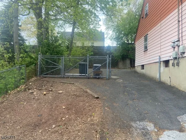 a backyard of a house with trampoline