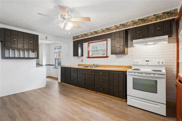 a kitchen with stainless steel appliances granite countertop a stove and a refrigerator