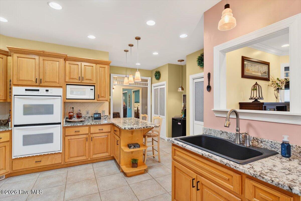 18 Brierwood Road Southwest Shallotte, NC 28470 - Photo 18 of 70 Chef’s kitchen featuring double ovens, dual cooktops (electric & gas), and generous counter space.