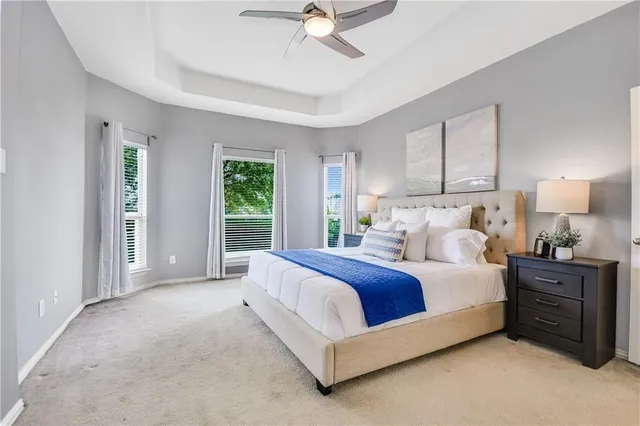 a spacious bedroom with a bed and window