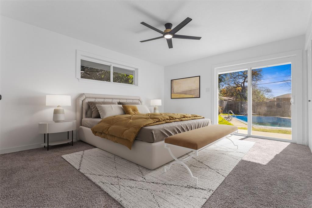 924 Whitestone Lane Dallas, TX 75232 - Photo 17 of 32 a spacious bedroom with a bed and glass window