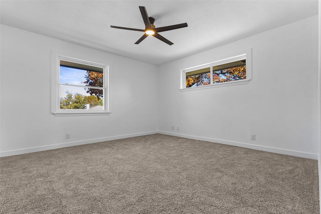 924 Whitestone Lane Dallas, TX 75232 - Photo 21 of 32 an empty room with a window