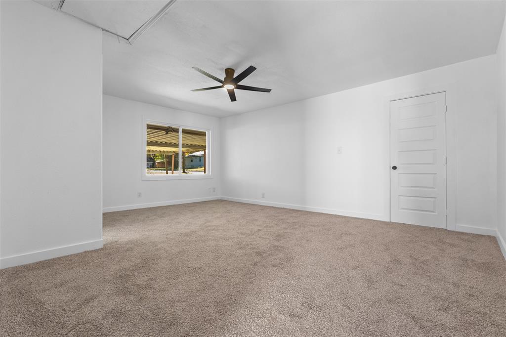 924 Whitestone Lane Dallas, TX 75232 - Photo 25 of 32 a view of an empty room with a window