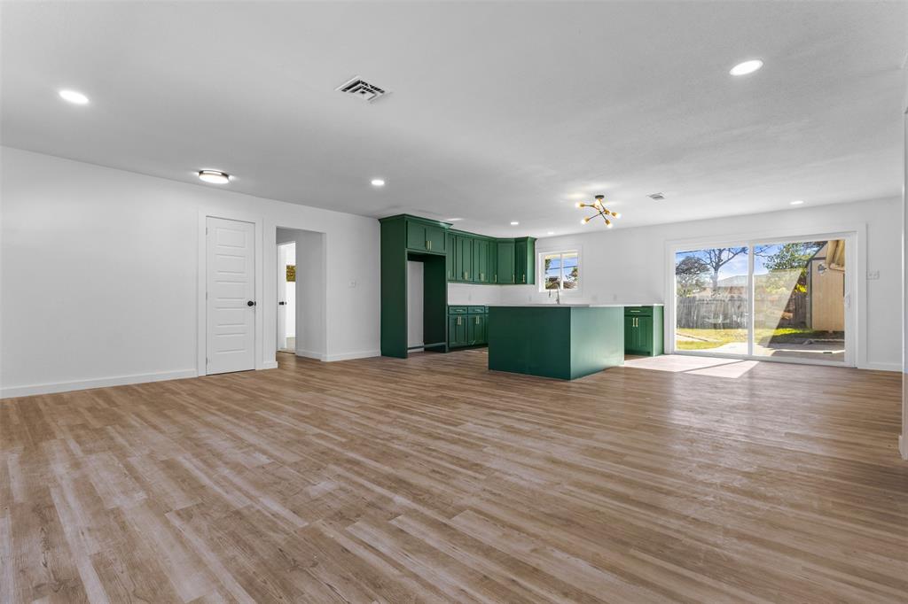 924 Whitestone Lane Dallas, TX 75232 - Photo 6 of 32 a view of empty room with wooden floor