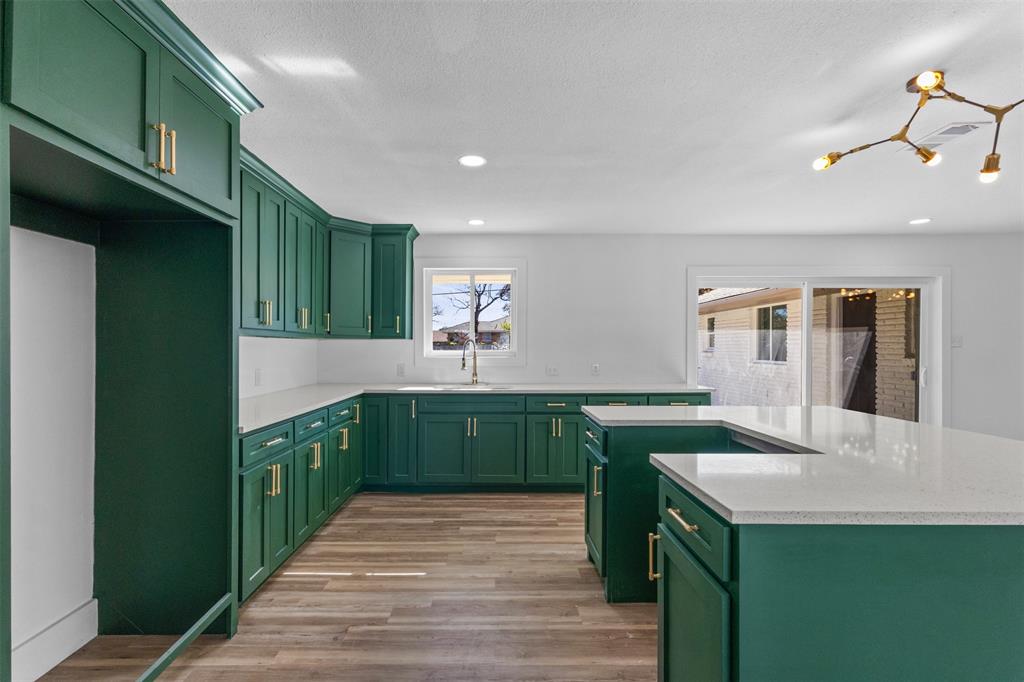 924 Whitestone Lane Dallas, TX 75232 - Photo 10 of 32 a kitchen with a sink and cabinets