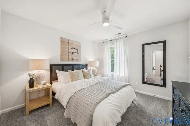 a bedroom with bed and window