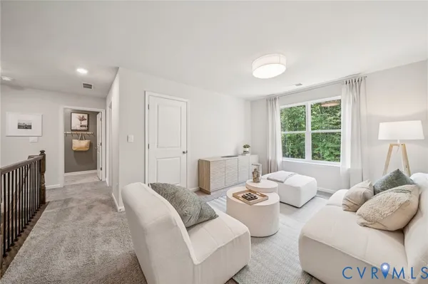 a bedroom with furniture and a window