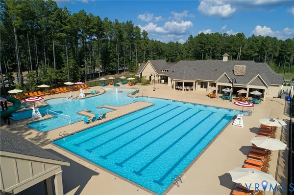 an aerial view of a house with swimming pool patio and mountain view