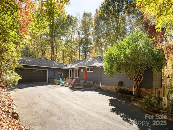 a view of the house with outdoor space and trees