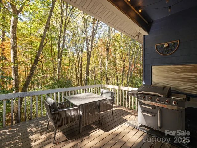 a view of a chairs and table in the balcony