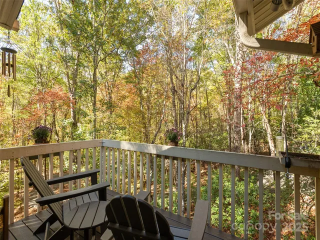 a view of a two chairs in the balcony