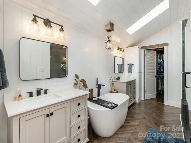 a bathroom with a sink double vanity and a mirror
