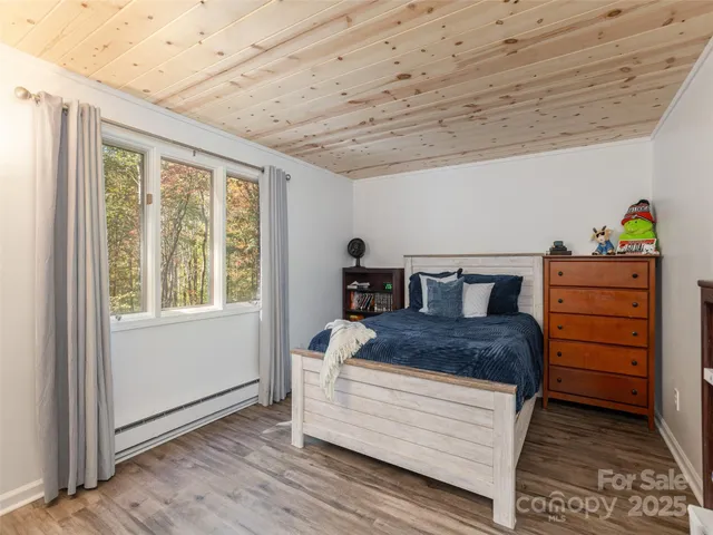 a bed room with a bed and a window