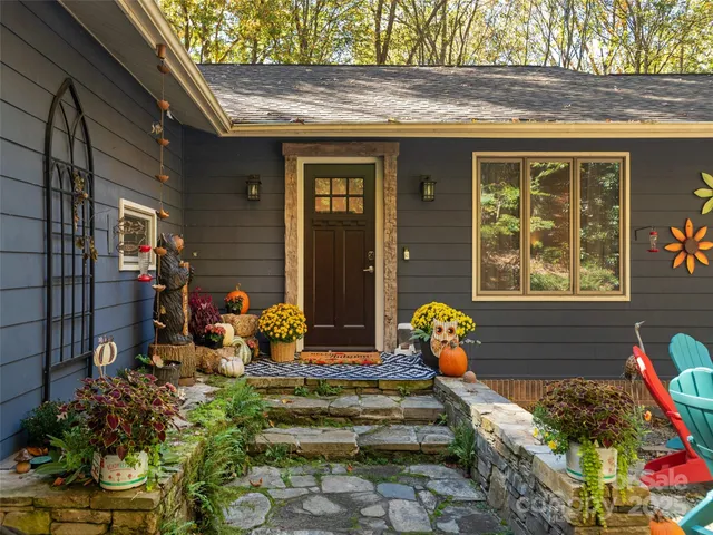 a front view of a house with outdoor seating