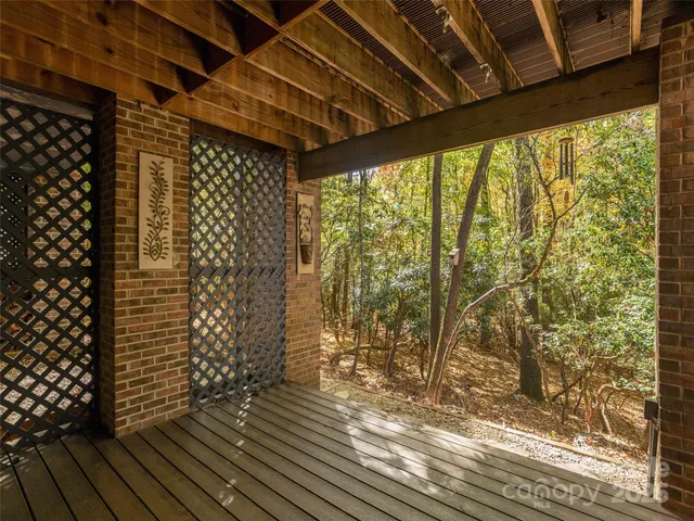 a view of outdoor space with wooden floor