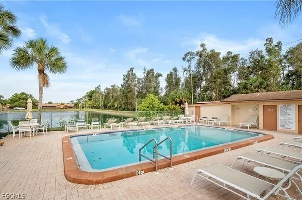 a view of a swimming pool with a patio