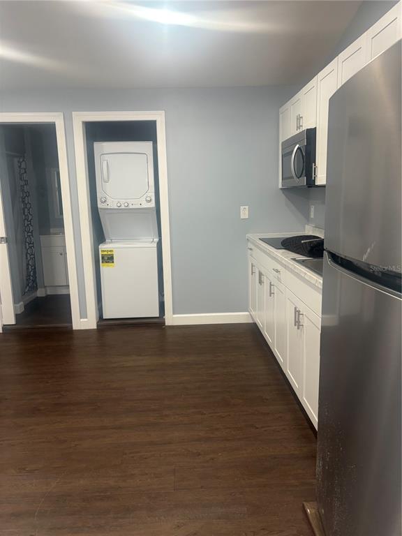 2371 Fletcher Trailer Park Road Haines City, FL 33844 - Photo 2 of 6 a kitchen with granite countertop a refrigerator stove and microwave