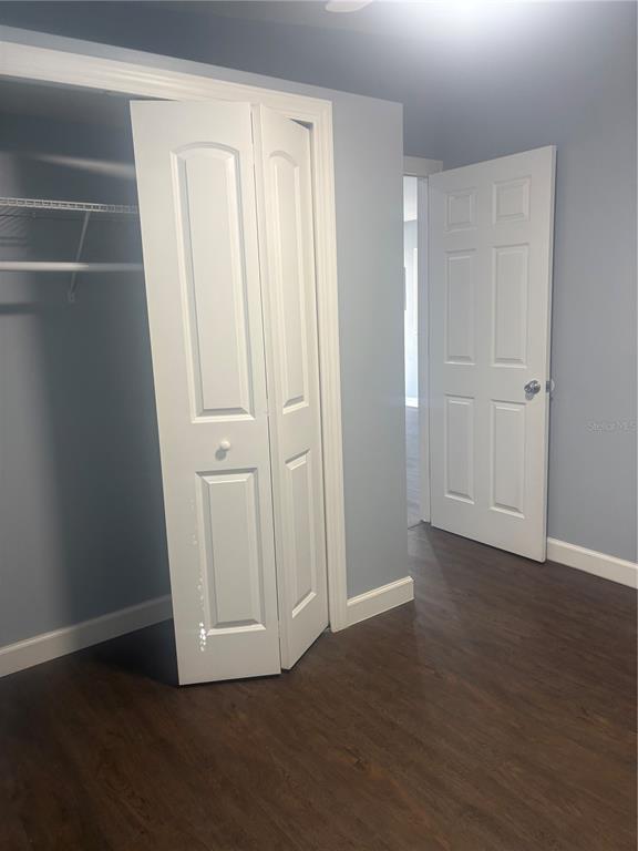 2371 Fletcher Trailer Park Road Haines City, FL 33844 - Photo 5 of 6 a view of empty room with wooden floor