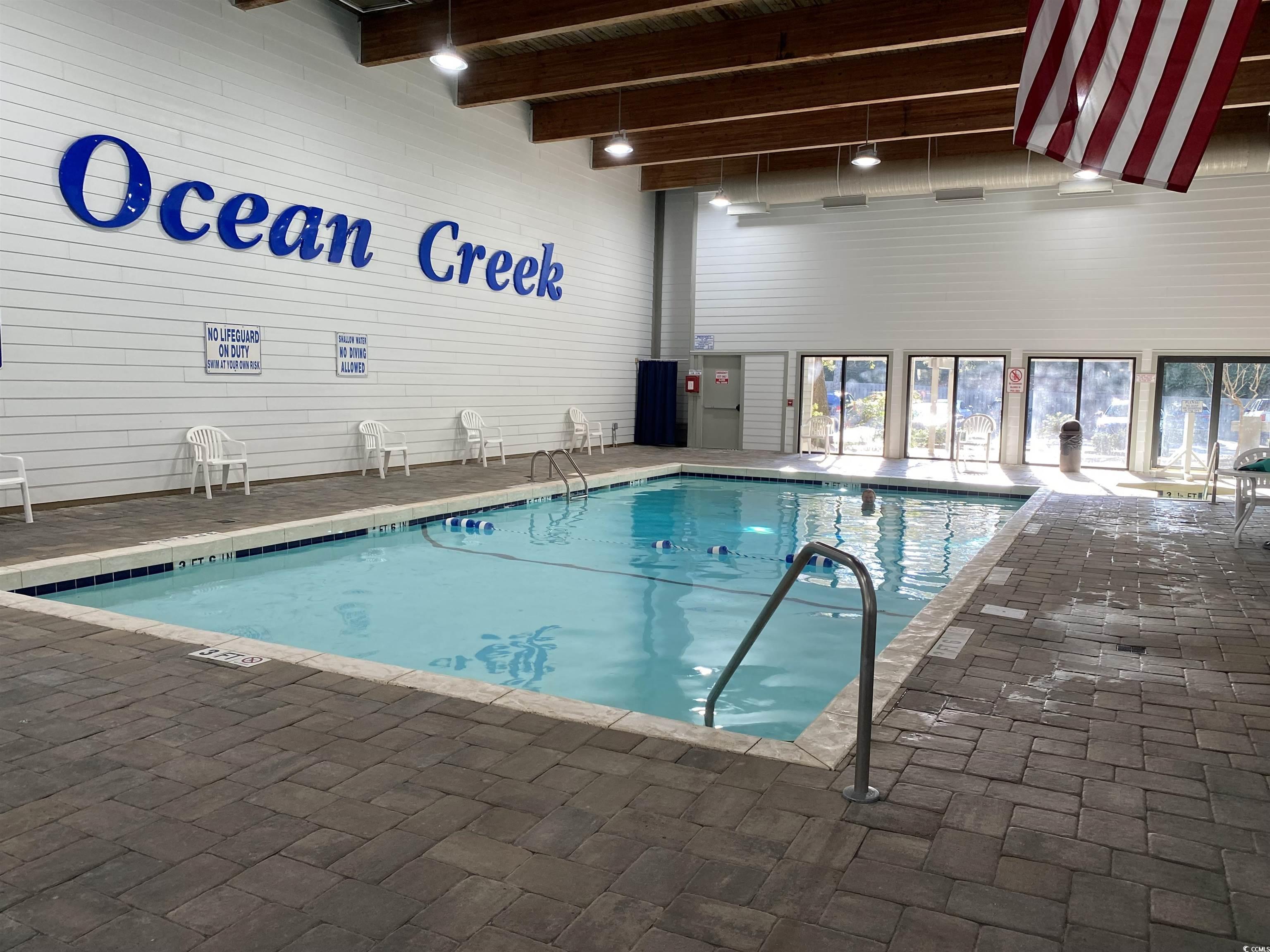 100 Ocean Creek Drive, Unit M3 Myrtle Beach, SC 29572 - Photo 27 of 32 Indoor pool featuring a patio