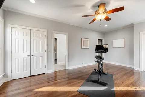 a view of a livingroom with a flat screen tv and wooden floor