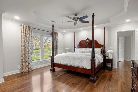 a bedroom with a large bed and a window