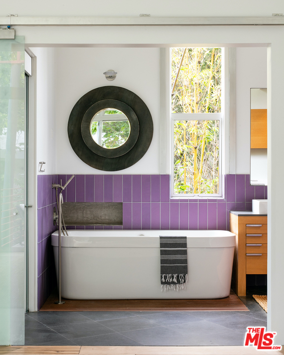 562 Stassi Lane Santa Monica, CA 90402 - Photo 13 of 33 a room with a couch and a window