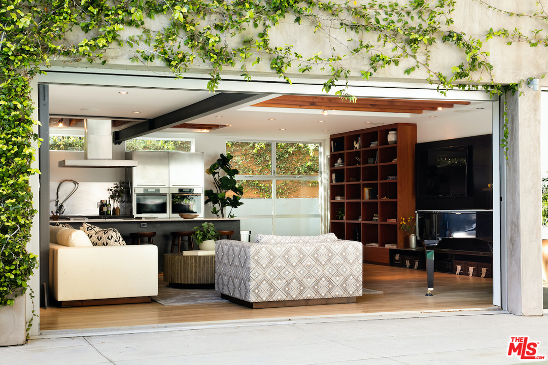 562 Stassi Lane Santa Monica, CA 90402 - Photo 3 of 33 a kitchen with a table and chairs