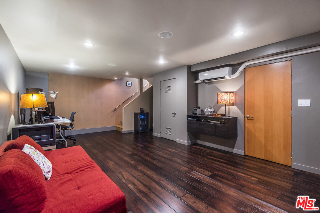 562 Stassi Lane Santa Monica, CA 90402 - Photo 30 of 33 a living room with furniture and a wooden floor