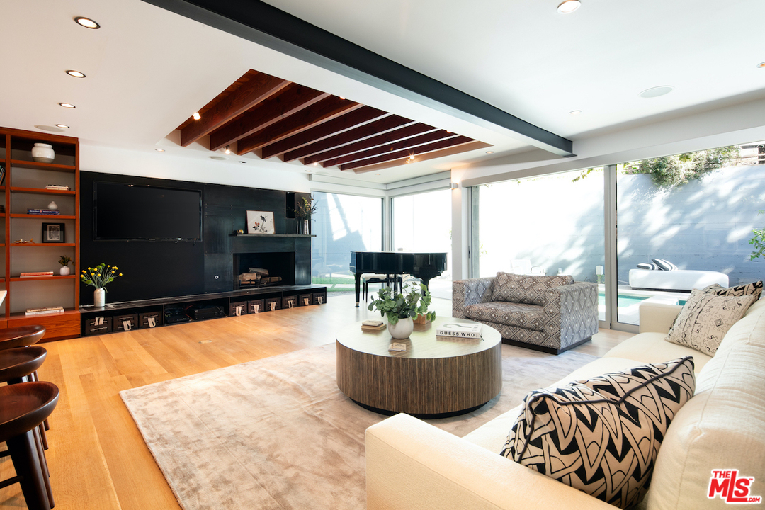 562 Stassi Lane Santa Monica, CA 90402 - Photo 4 of 33 a living room with furniture and a flat screen tv