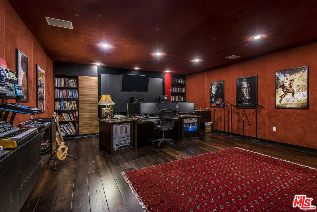 562 Stassi Lane Santa Monica, CA 90402 - Photo 33 of 33 a living room with furniture a flat screen tv and a rug