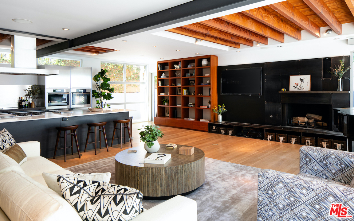 562 Stassi Lane Santa Monica, CA 90402 - Photo 5 of 33 a living room with furniture and a flat screen tv