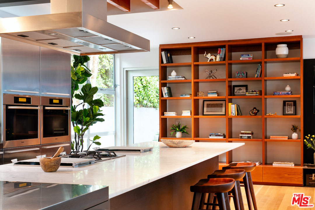 562 Stassi Lane Santa Monica, CA 90402 - Photo 7 of 33 a view of a dining room with a table and chairs