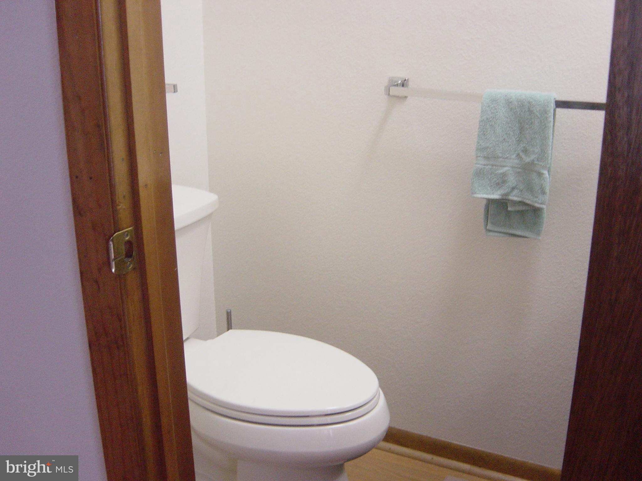 13609 Derrickson Avenue, Unit B Ocean City, MD 21842 - Photo 12 of 47 a white toilet sitting next to a shower