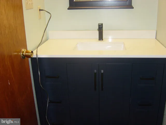 a bedroom with a bed and flat screen tv