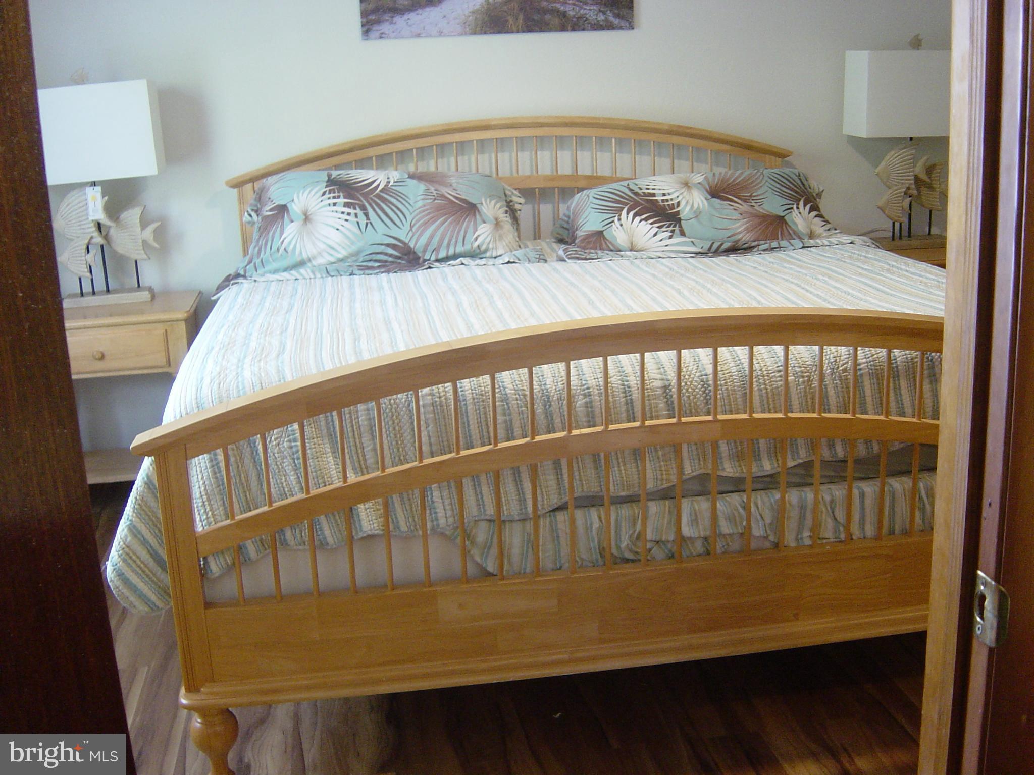 13609 Derrickson Avenue, Unit B Ocean City, MD 21842 - Photo 28 of 47 a bedroom with a bed and a window