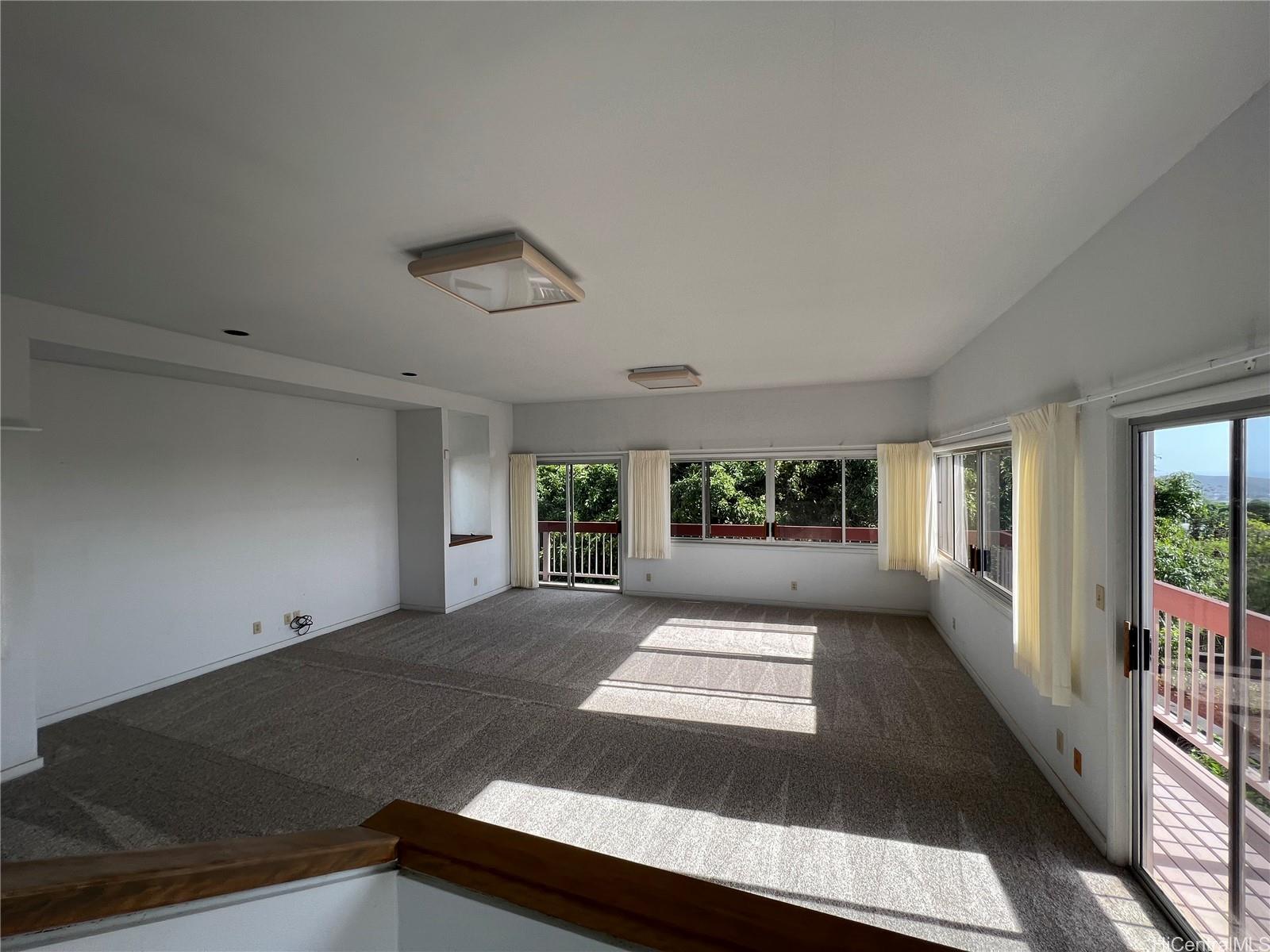98-1305 Akaaka Street Aiea, HI 96701 - Photo 13 of 23 a view of a hallway with stairs