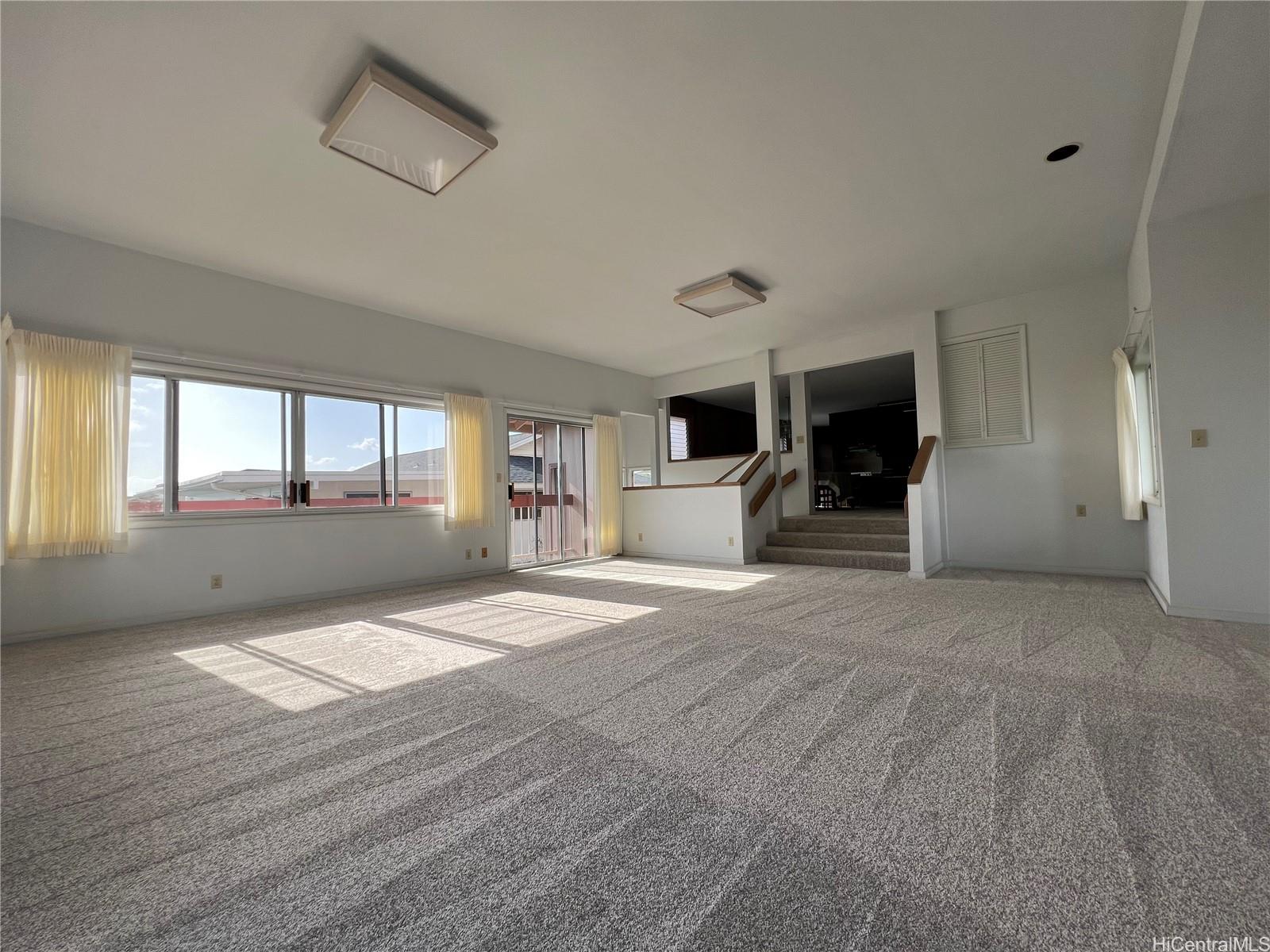 98-1305 Akaaka Street Aiea, HI 96701 - Photo 14 of 23 a view of an empty room with a window and fireplace