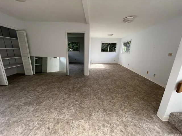 an empty room with shelves