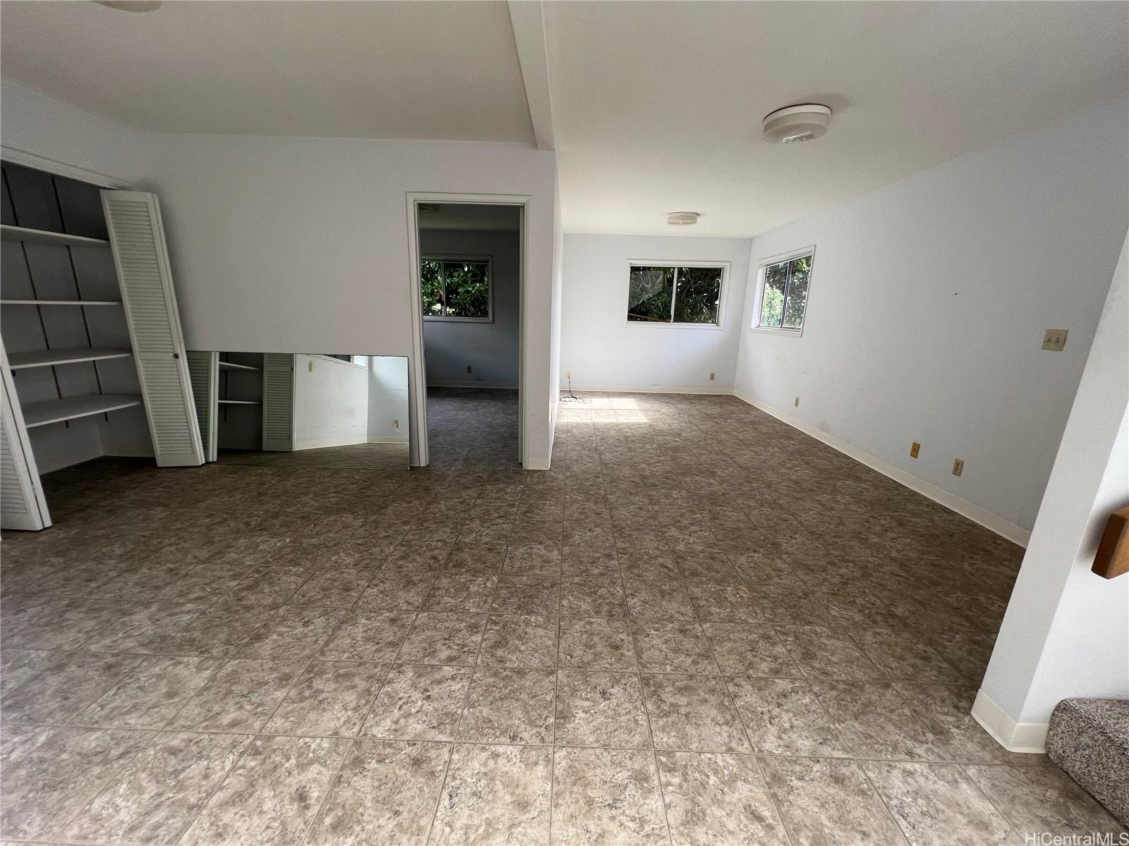 98-1305 Akaaka Street Aiea, HI 96701 - Photo 18 of 23 an empty room with shelves