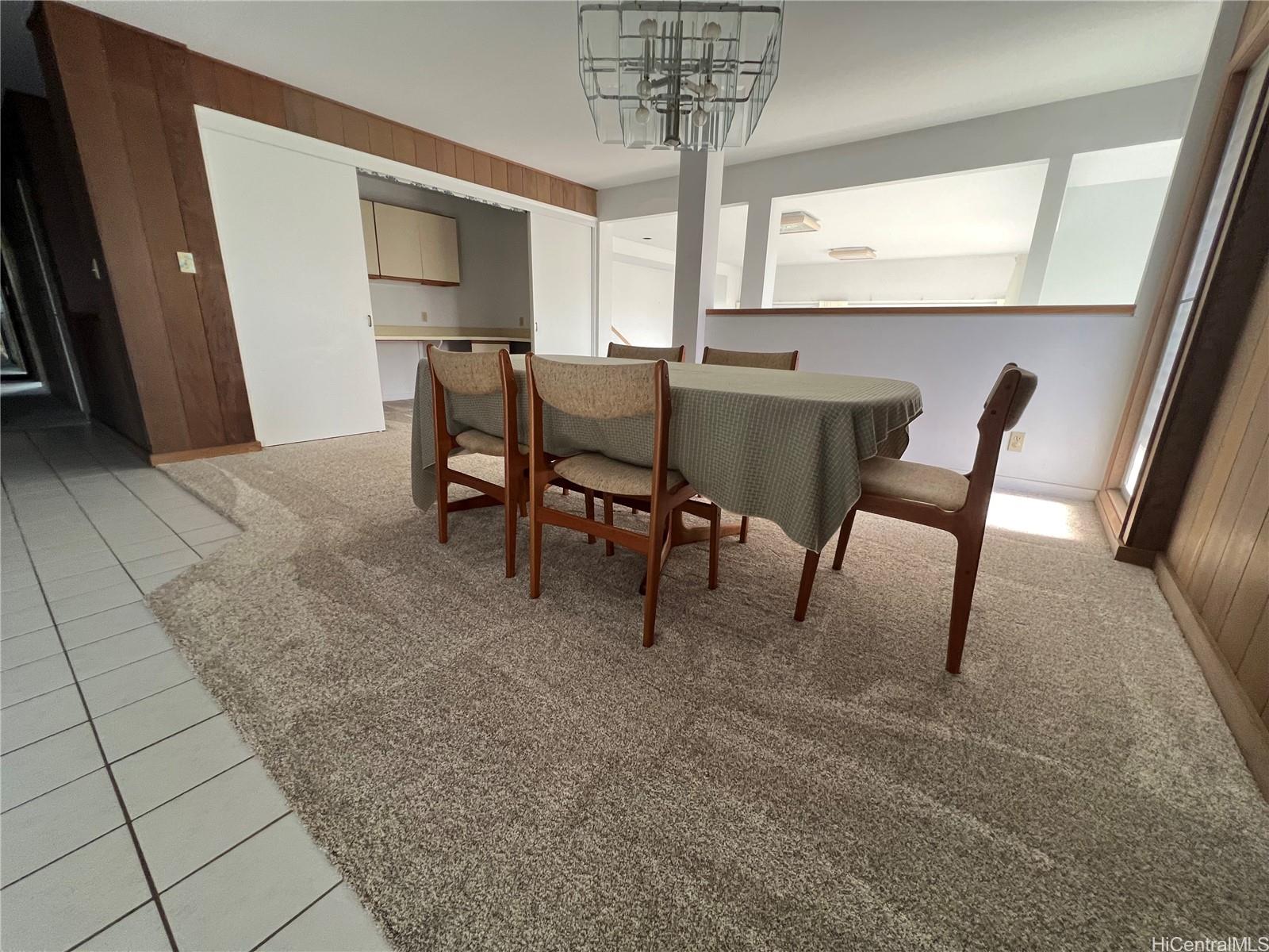 98-1305 Akaaka Street Aiea, HI 96701 - Photo 2 of 23 a view of a dining room with furniture and window